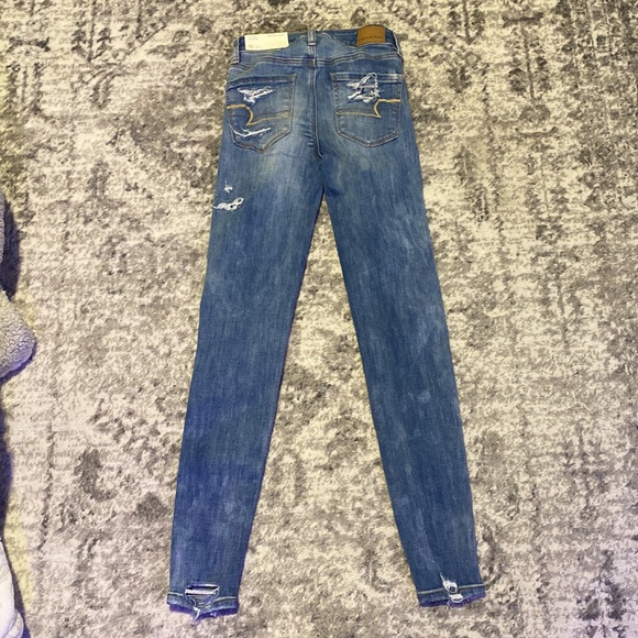 I am selling high rise blue ripped jeans.They are a 00 and ne(x)t level stretch. - Picture 2 of 2